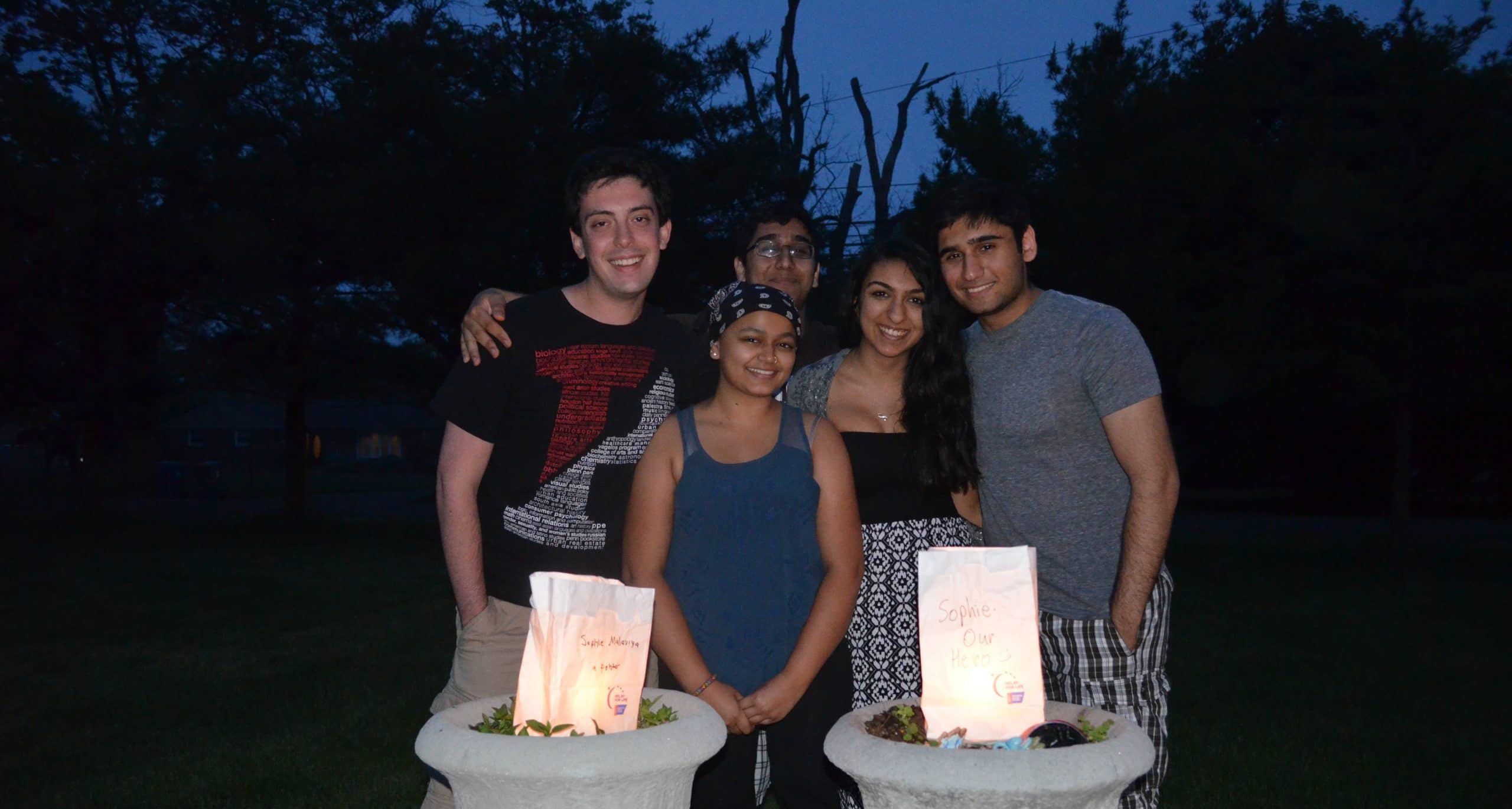 Sophie with friends at luminaria ceremony